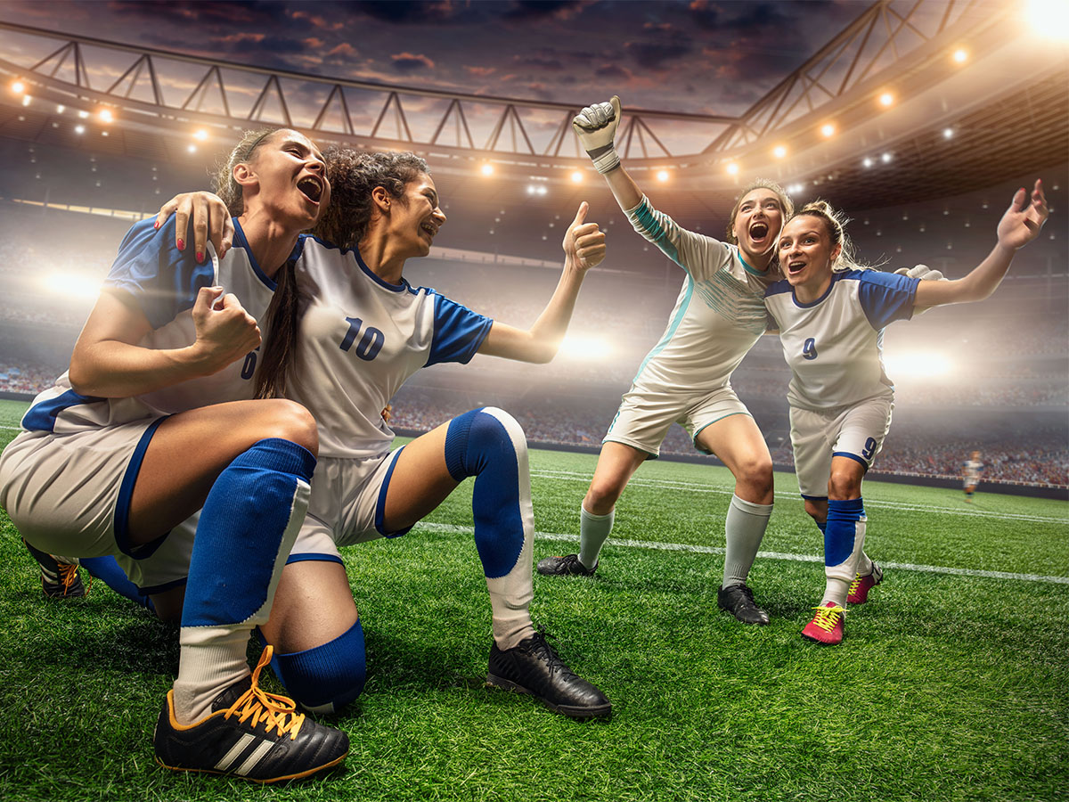 Happy,Female,Soccer,Players,On,A,Professional,Soccer,Stadium.,Girls